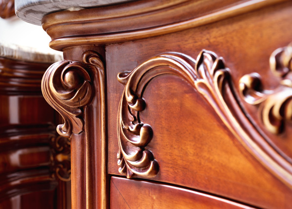 close up of antique drawers and carved design