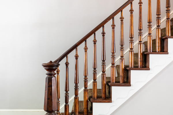 wooden staircase against white wall