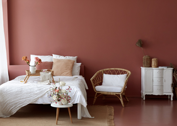 minimal and modern rose blush bedroom with with accent furniture and pink roses